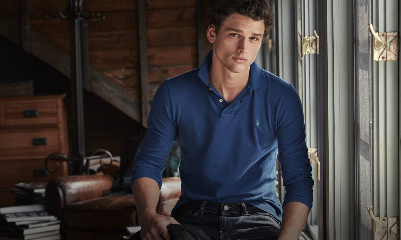 Man in long-sleeve blue Polo shirt accented with embroidered Polo Pony